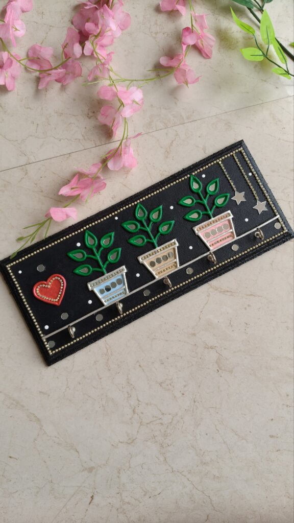 Mini garden key holder for wall with colourful pots and green leaf design. Handcrafted by KaushalS Creations